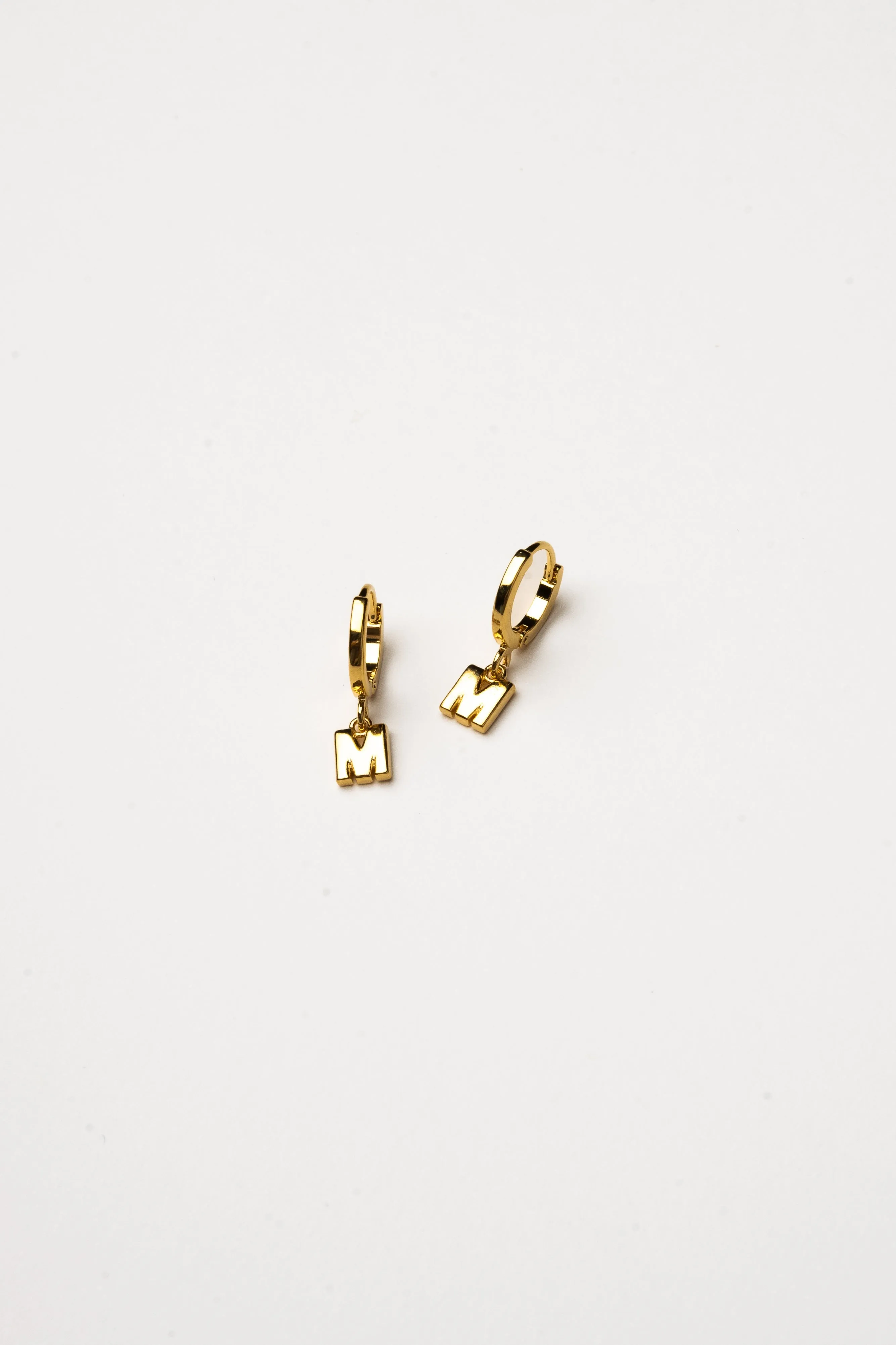 Cove Initial Letter Huggie Earrings