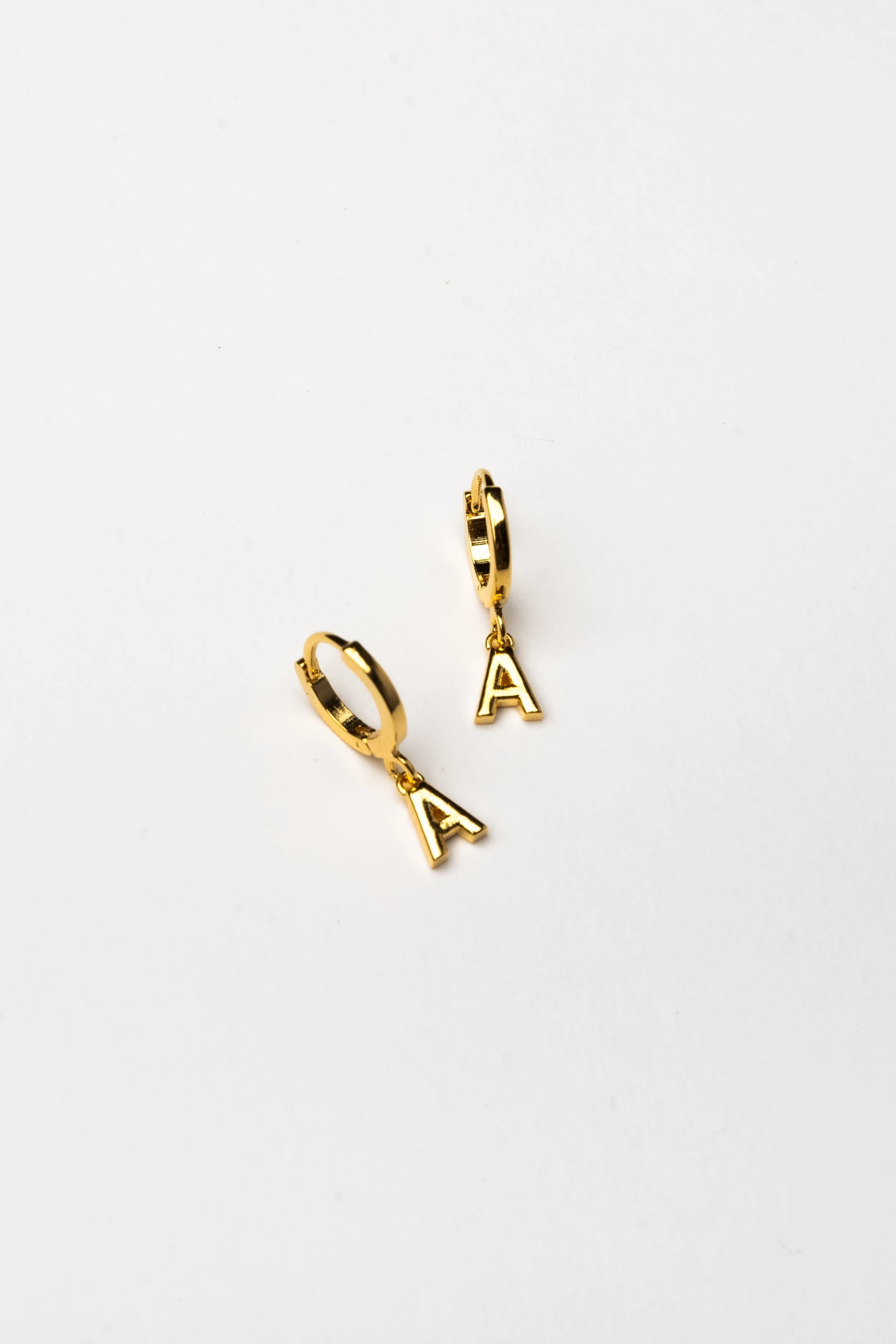 Cove Initial Letter Huggie Earrings